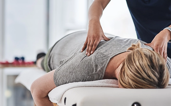 Chiropractic Sunrise Beach MO Woman Receiving Chiropractic Adjustment